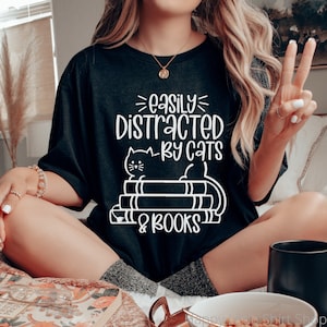 Easily Distracted by Cats and Books Shirt, Bookish Shirt, Librarian Shirt, Cat Mom Shirt, Book Nerd Gifts, Literature Shirt, Book Gift