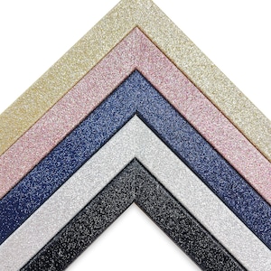 May include: Five picture frames with glitter finishes in gold, pink, navy blue, silver, and black.