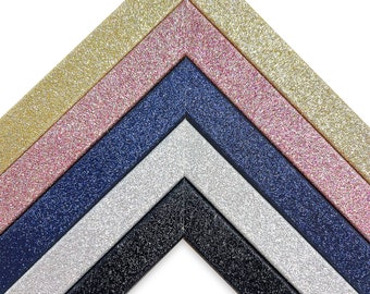 May include: Five picture frames with glitter finishes in gold, pink, navy blue, silver, and black.