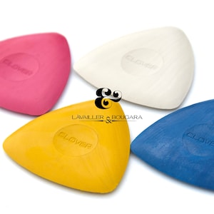 May include: Four Clover brand tailor's marking tools in pink, white, yellow, and blue.