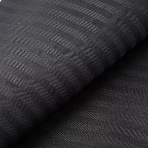 May include: Black fabric with a herringbone pattern. The fabric is folded in half, showing the texture of the weave.