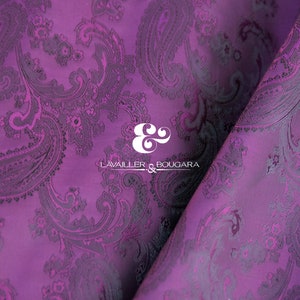 May include: Purple paisley patterned fabric with a white logo that reads "LAVAILLE & BOUGARA" in the centre.