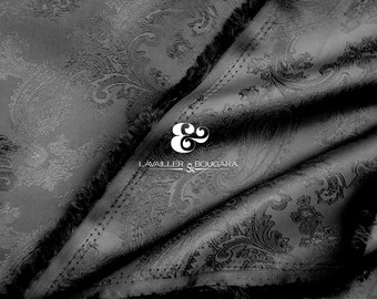 May include: Black paisley patterned fabric with a white embroidered logo that reads "& & LAVAILLE & BOUGARA"