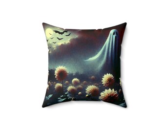 May include: Square throw pillow featuring a spooky Halloween design. The artwork depicts a ghost floating over a field of flowers under a moonlit sky with bats. The color palette includes shades of blue, purple, and yellow.