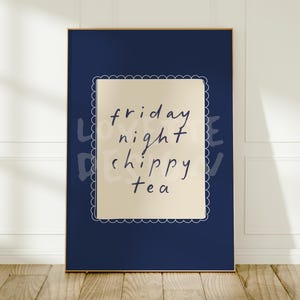 May include: A rectangular wall art print featuring a deep navy blue background and a central cream-colored rectangle with a white scalloped border. The text "friday night chippy tea" is written in a dark blue, handwritten-style script font.