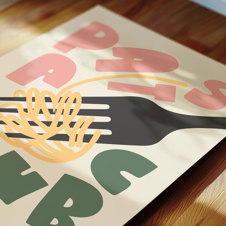 May include: A poster with the word "PASTA" in pink and green block letters. A black fork holds yellow spaghetti. A yellow line curves across the top of the fork. The background is a light beige color.