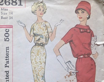 May include: Vintage Simplicity sewing pattern number 2681 for a dress. The pattern is for a size 14 with a bust measurement of 34 inches. The pattern is for a dress with a simple design and is described as "Simple to make".