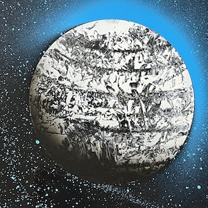 Black and white planet with oasis blue stars & shine