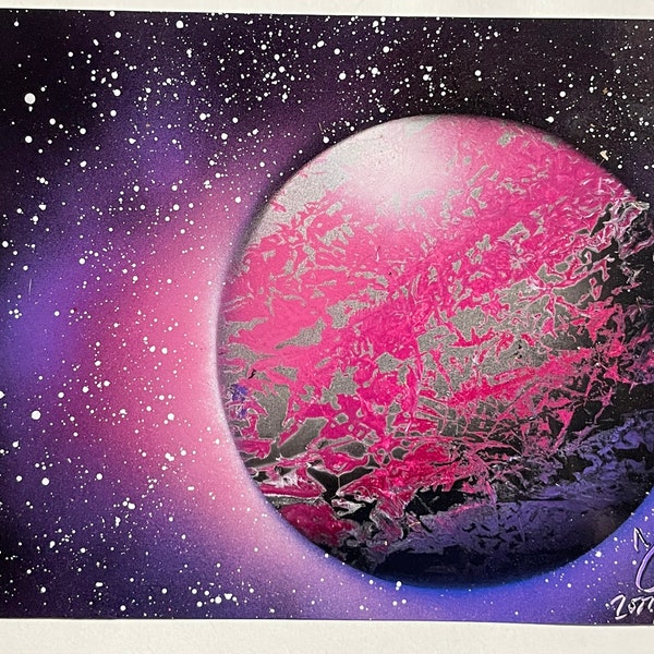 Pink planet with nebula