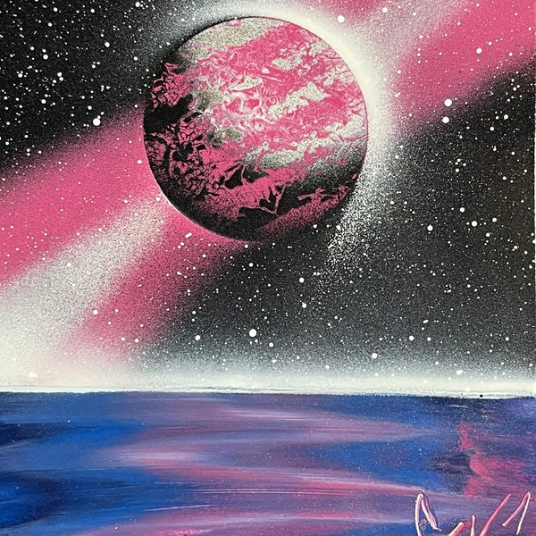 Pink moon over water