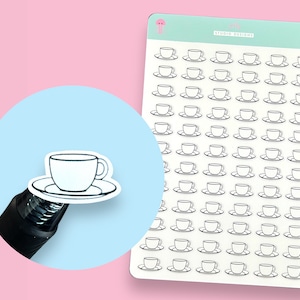 May include: A sheet of 100 white teacup and saucer stickers. The stickers are outlined in black and are arranged in a grid pattern. The sheet is on a pink background.