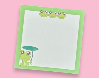 May include: Green notepad with a green frog holding a lily pad and four green frogs with pink cheeks around the border.