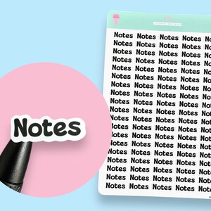 May include: A sheet of white sticker paper with black text that reads "Notes" repeated multiple times. The sticker paper is on a light blue background. A pink circle with a black sticker that reads "Notes" is in the foreground.
