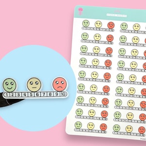 May include: A sheet of colourful mood tracker stickers with a scale of 1 to 10. The stickers feature three different smiley faces: green for happy, yellow for neutral, and red for sad. The sheet is labelled "Mood Stickers".