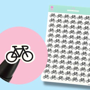 May include: A sheet of bicycle stickers with a light blue background and a pink circle. The stickers are black and white, featuring a simple bicycle design. A single sticker is shown on a black pen.