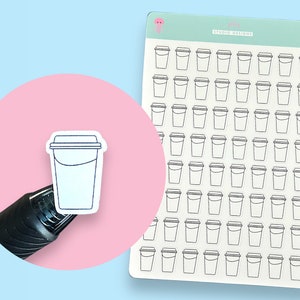 May include: A sheet of clear stickers with 64 outline drawings of coffee cups. The stickers are on a white background with a pink border. The text "jelly studio designs" is printed in black on the sheet.
