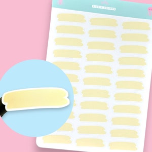 May include: A sheet of 20 yellow rectangular stickers with rounded corners. The stickers are blank and can be used for labelling, journaling, or other craft projects.