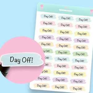 May include: A sheet of colourful stickers with the text "Day Off!" repeated multiple times. The stickers are in various pastel colours, including pink, yellow, green, and blue.
