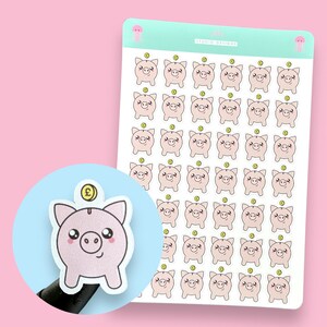 May include: A sheet of 50 pink piggy bank stickers with a gold coin on top. Each sticker has a cute cartoon face. The stickers are perfect for adding a touch of whimsy to your planner, journal, or laptop.