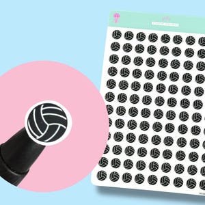 May include: Sheet of volleyball stickers with a black and white design. The stickers are arranged in rows and columns on a white background. A close-up shows a single sticker on a black pen. The background is light blue and pink.