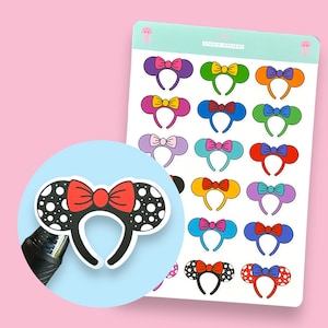 May include: A sheet of colorful mouse ear stickers with a polka dot design. The stickers are arranged in a grid pattern and feature different colors, including red, blue, green, yellow, and purple. The stickers are perfect for adding a touch of whimsy to planners, journals, and other craft projects.