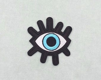 Iron-on eye patch, embroidered badge