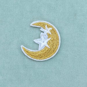 Broderad guldfärgad stryklapp med månen, guldfärgad stryklapp med vit kant