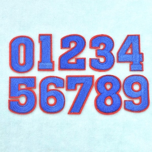 May include: A set of ten embroidered patches featuring the numbers zero through nine. Each digit is rendered in a vibrant blue thread with a bold red border, showcasing a clean, block-style font design suitable for various textile applications.