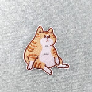 リラックスしたジンジャーキャットパッチ、刺繍アイロンパッチ、アイロンパッチ、縫い付けパッチ、服やアクセサリーのカスタマイズ