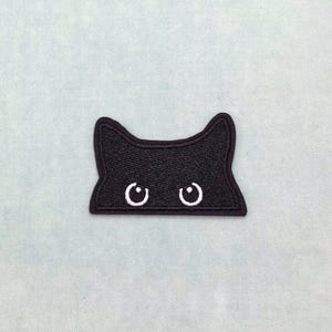 Zwarte kattenogen-patch (4,5 cm/7 cm), geborduurde strijkpatch