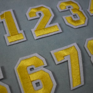 Yellow number patches, iron-on embroidered number patches, to customize clothing and accessories