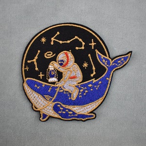 Astronaut patch on embroidered whale, cosmonaut iron-on patch