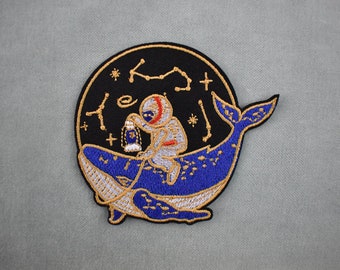 Astronaut patch on embroidered whale, cosmonaut iron-on patch