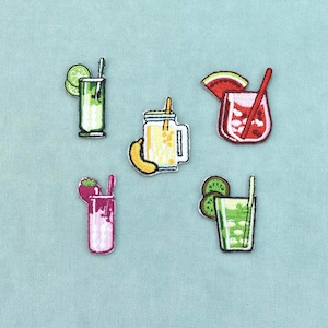 May include: Five embroidered patches featuring colourful beverage designs. The set includes a green lime drink, a yellow banana smoothie in a mason jar, a red watermelon cocktail, a pink strawberry drink, and a green kiwi fruit beverage with straws.