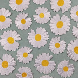 Iron-on or sew-on embroidered daisy patch in two sizes to customize clothing and accessories