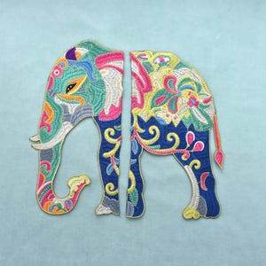 May include: Two embroidered elephant patches featuring intricate, colorful patterns in shades of teal, blue, pink, yellow, and white. The left patch shows the head and front legs, while the right patch displays the back body and hind legs.