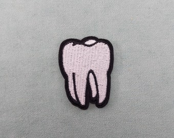 Iron-on tooth patch, embroidered badge