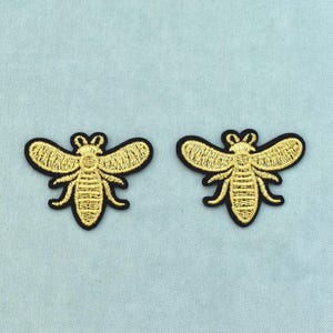 Set van 2 gouden strijkpatches met vliegende insecten, duo-patches, opnaaipatches, om kleding en accessoires mee te personaliseren.
