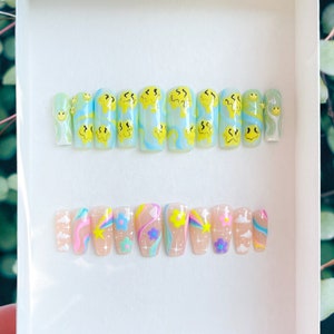 SUZZIE Hand Painted Melted Smiley Faces w/ Abstract Baby Blue and Yellow Lines on Shimmery Baby Blue Background Kid Core Press On Nails image 2