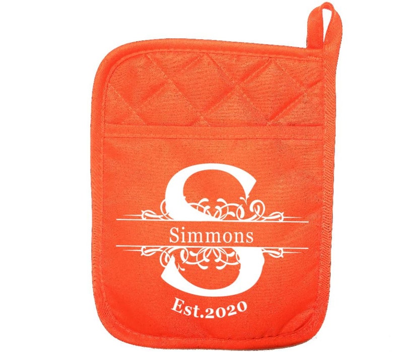 May include: Orange quilted pot holder with a white monogram design. The monogram features the letter "S" with a decorative flourish and the text "Simmons Est. 2020".