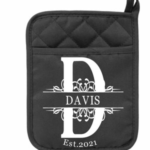 May include: Black quilted oven mitt with a white monogrammed initial "D" and the text "DAVIS Est. 2021".