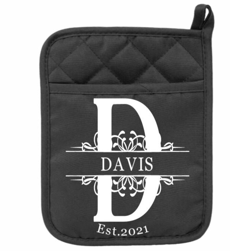 May include: Black quilted oven mitt with a white monogrammed initial "D" and the text "DAVIS Est. 2021".