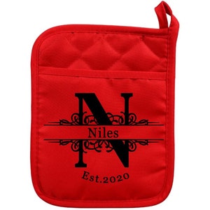 May include: Red quilted pot holder with a black letter N, the name Niles, and the text Est. 2020.