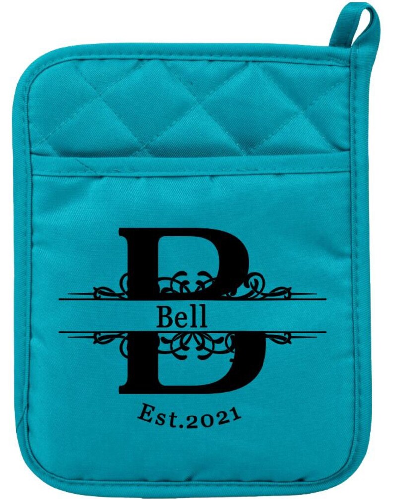 May include: Teal quilted oven mitt with a black letter "B" and the text "Bell Est. 2021" in a decorative font.