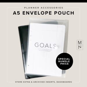 May include: A clear plastic A5 envelope pouch for storing planner inserts and dashboards. The pouch is labeled "A5 Envelope Pouch" and has the text "Goals" printed on a white sheet inside. The text "Special Bundle Price" is printed on a black circle.