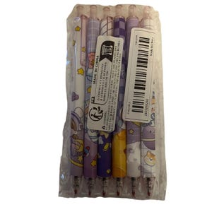 Set de seis bolígrafos retráctiles kawaii astronauta violeta tinta negra .5 mm
