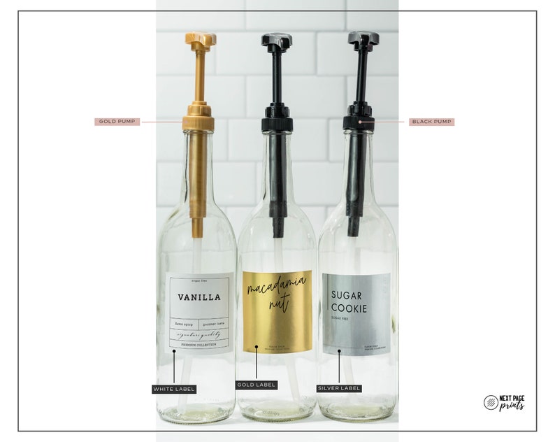 May include: Three clear glass bottles with pump dispensers. One has a gold pump and a white label that says "VANILLA". The second has a black pump and a gold label that says "macadamia nut". The third has a black pump and a silver label that says "SUGAR COOKIE".