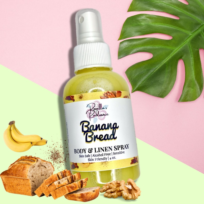 May include: A yellow spray bottle with a white cap and label that reads "Bovella's Radiance Banana Bread Body & Linen Spray Skin Safe | Alcohol Free | Sensitive Skin Friendly | 4 oz."