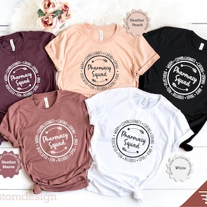 May include: Five different color t-shirts with a white circle design that says "Pharmacy Squad" with arrows and the words "Warm, Compassionate, Caring, Loving, Dedicated, Fun, Reliable, Loyal, Kind" around the circle.