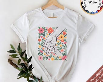 Mom Holding Child Hand Shirt - Floral Mother's Day Gift, Aesthetic Mama T-shirt, Sentimental New Mom Gift, Hand in Hand Floral Garden Tee